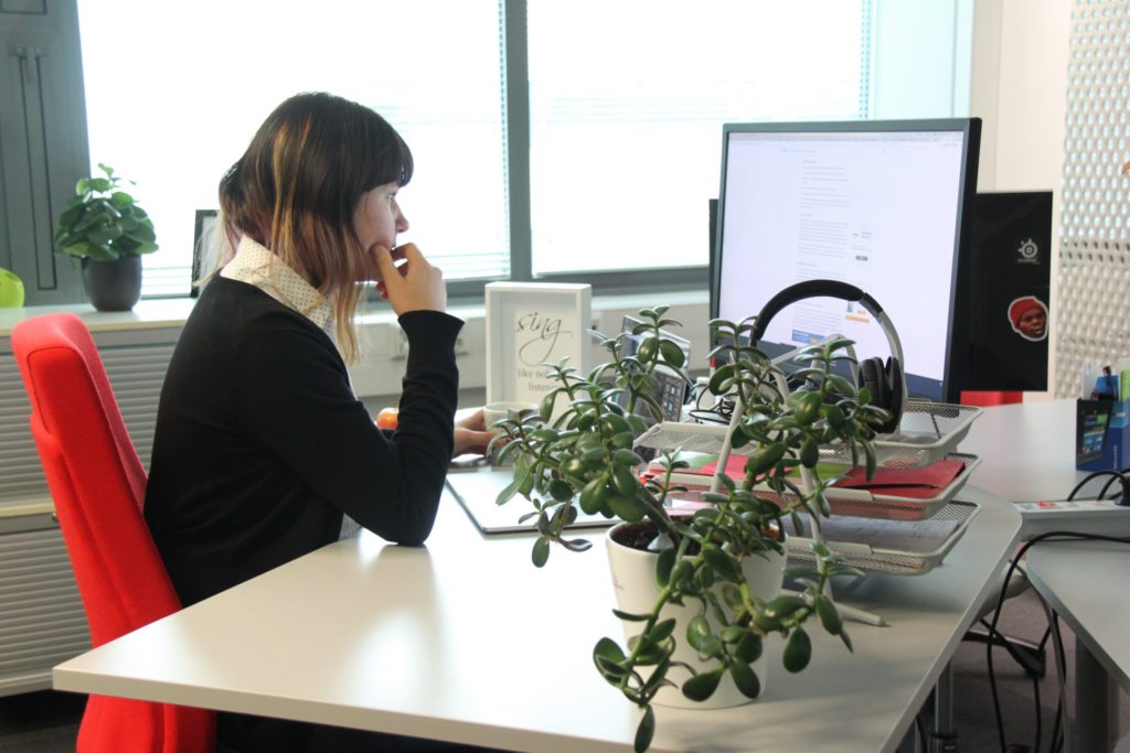 Person at her desk doing work